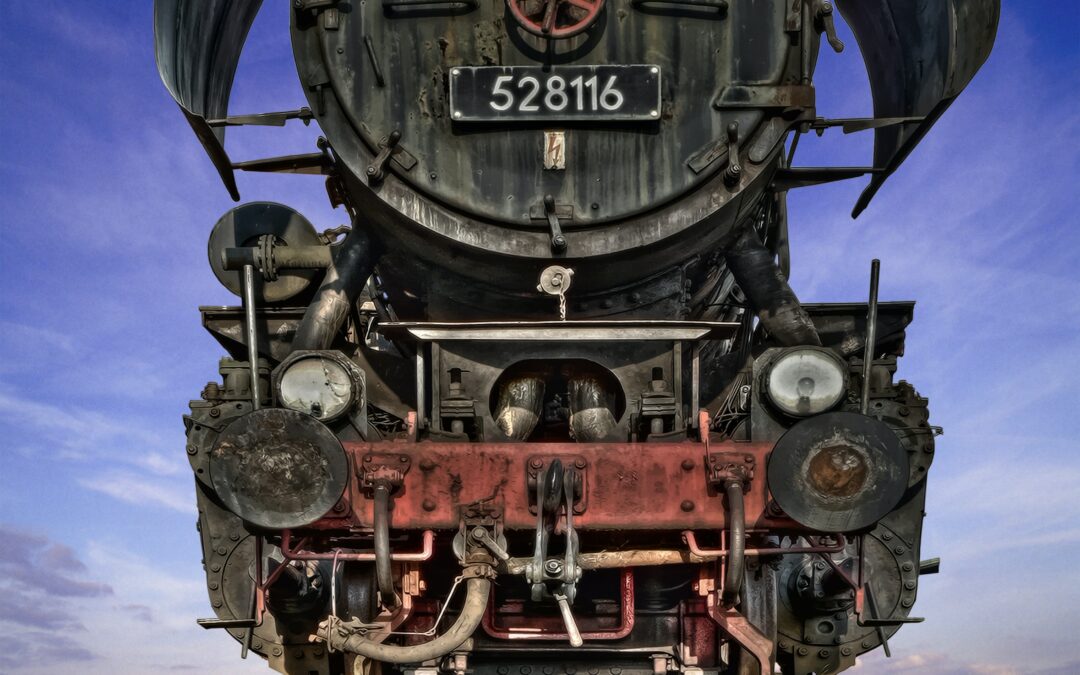 black and red train on rail tracks